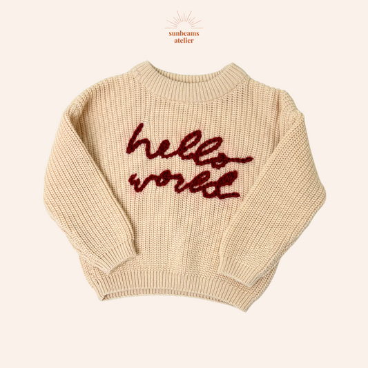 Strickpullover in Ivory mit roter Bestickung "Hello World"